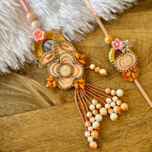 Load image into Gallery viewer, Richly Adorned Pearl Lumba with Bhai Rakhi Pair

