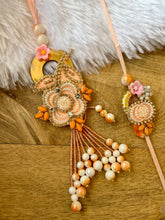 Load image into Gallery viewer, Richly Adorned Pearl Lumba with Bhai Rakhi Pair
