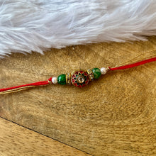 Load image into Gallery viewer, Delicate Kundan Meena Rakhi
