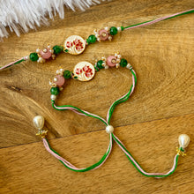 Load image into Gallery viewer, Stunning Pichhwai Lotus Braclet and Bhai Rakhi Pair
