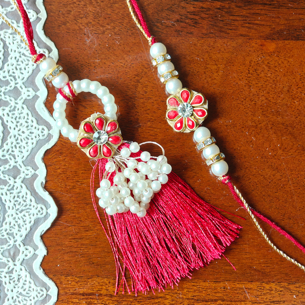 A graceful combination of red and white. Embellished with floral beauty and pearl tassels.