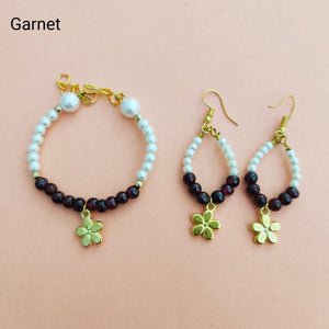 Lovely bracelet with semi-precious stone garnet along with a pair of earrings for all the barbies out there